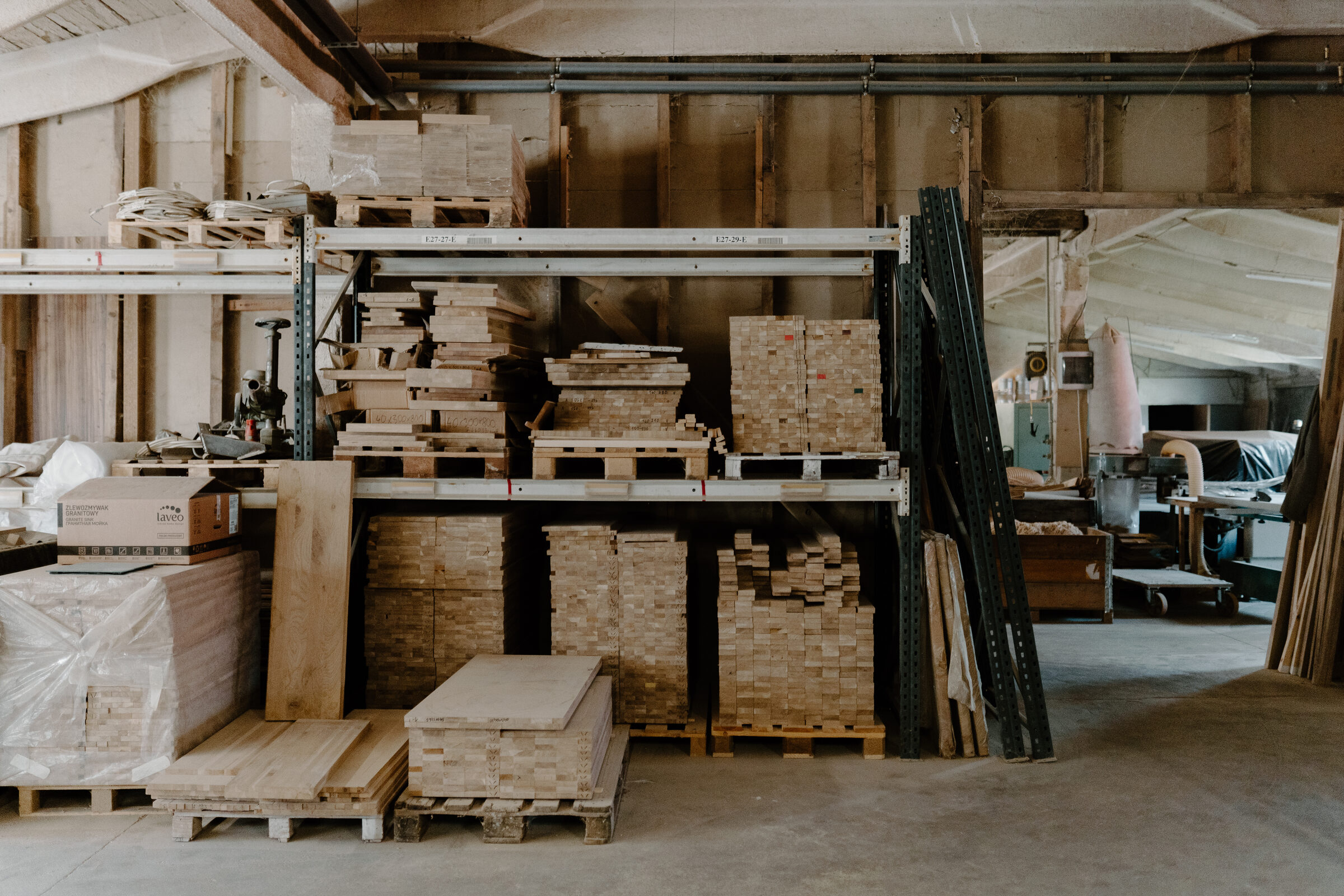 Pallets of cut and stacked timber inside the Siguldas Koks workshop